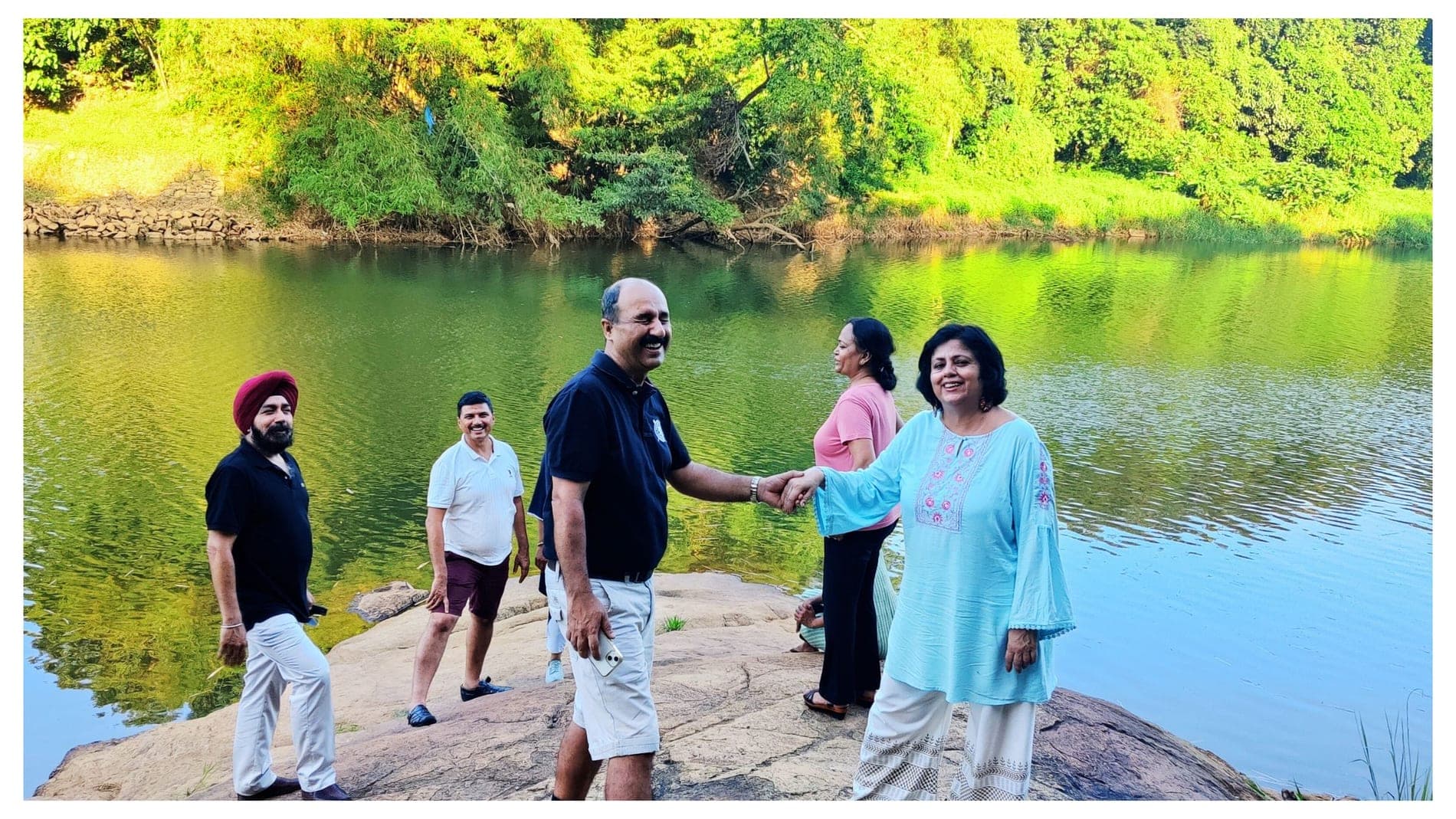 The family at Nature's Gold Farms by the river